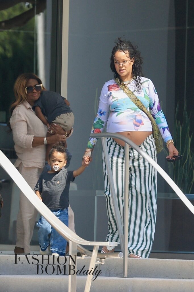 rihanna steps out in floral chopova lowena blue chameleon top and green striped savage x fenty pants with her mom and sons rza and riot in beverly hills
