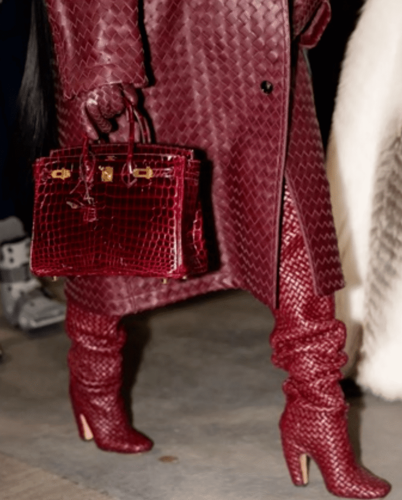 cardi b and stefon diggs spotted at gillette stadium—the rapper wears $17k burgundy bottega veneta leather look