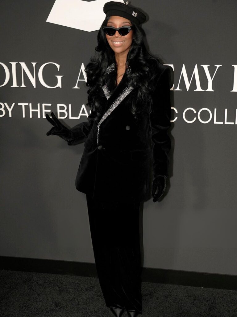 brandy in a black velvet crystal embellished balmain blazer and beret at the recording academy honors